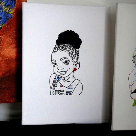 Hand-embroidered woven canvas artwork.